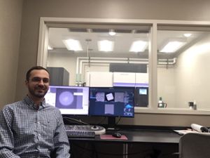 MSU Assistant Professor Ben Orlando sits inside MSUâ€™s Cryo-EM Facility. 